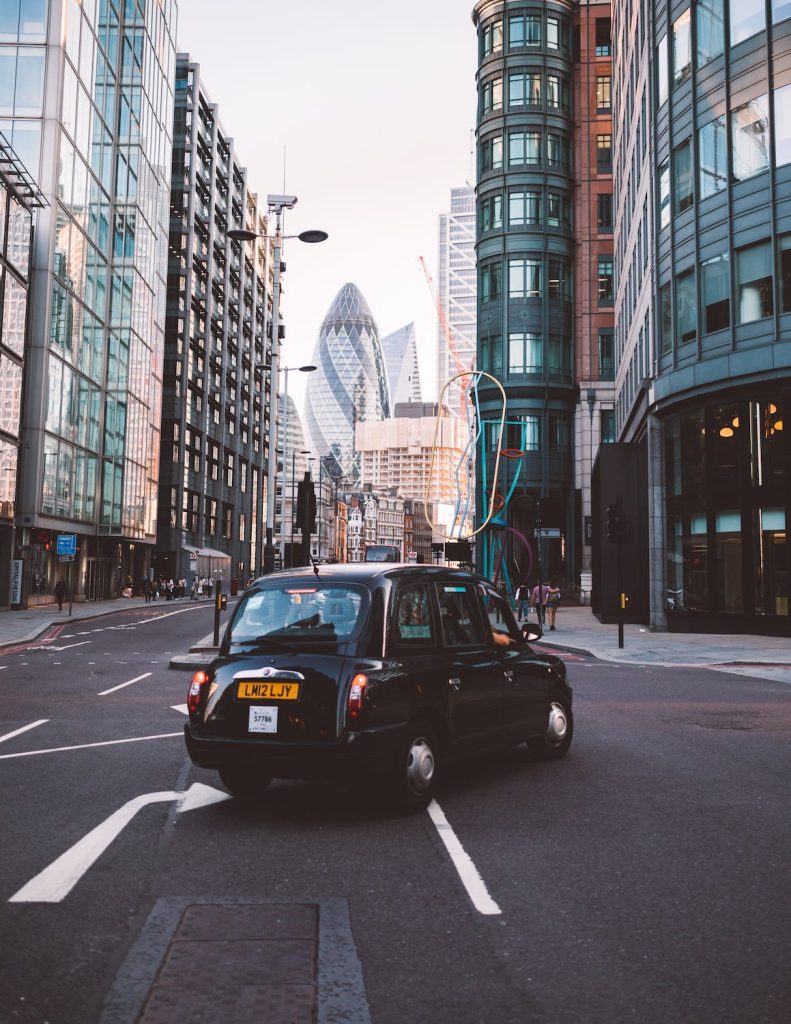 An image of London, with a black cab in the middle of the road, web design London