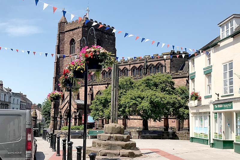 an image showing Newport Shropshire, the church of St Nicholas in the background and the buttercross in the foreground, newport web design